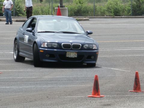 2001 Mercury Grand Marquis - A blue BMW coupe navigates a course marked by orange cones, with the license plate DDS 126 visible.