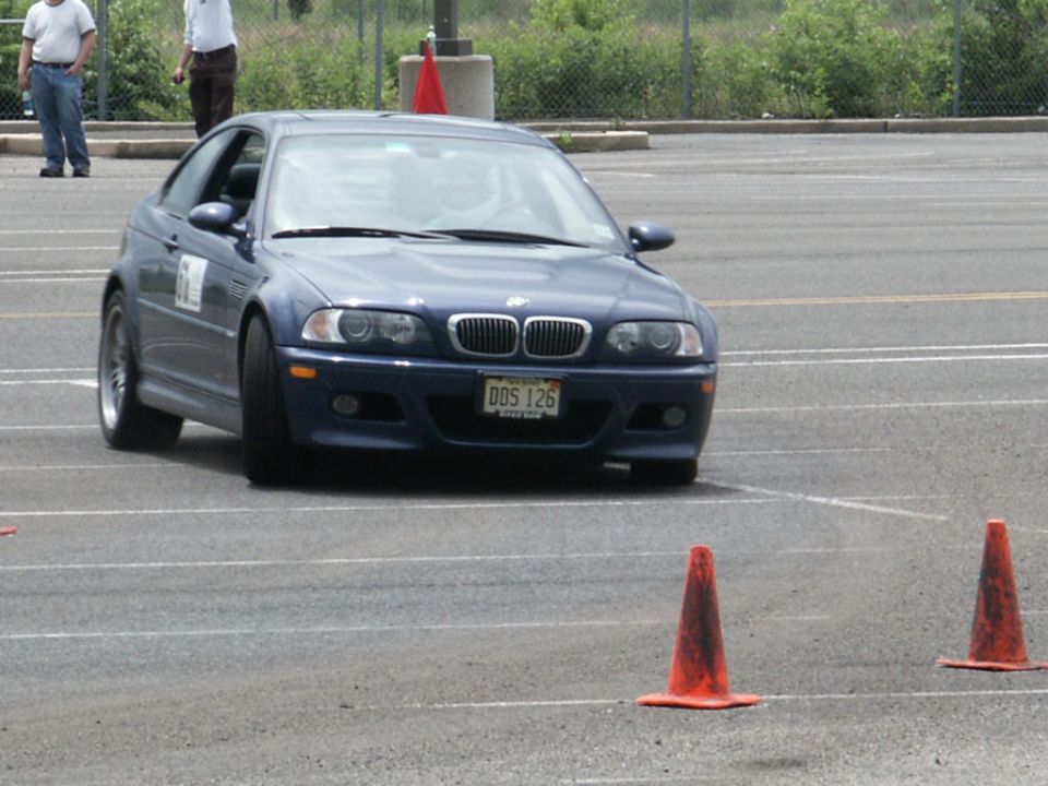 Blue BMW coupe with license plate DDS 126 on a track