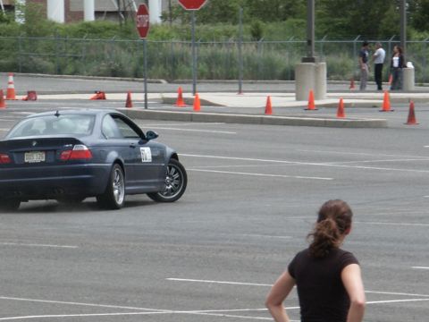 2001 Mercury Grand Marquis - A dark blue BMW M3 coupe navigates a course marked by orange cones.