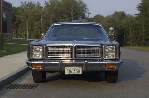 1978 Dodge Monaco - This sedan features a prominent chrome grille and dual headlights, with a license plate indicating it is an antique vehicle.