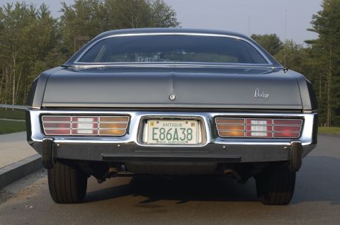 1978 Dodge Monaco - The rear of a 1978 Dodge Monaco is shown, its distinctive horizontal taillights and chrome bumper.