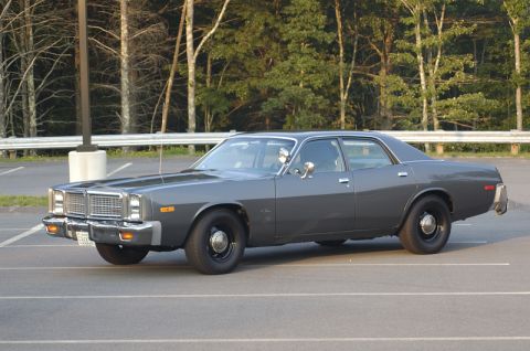1978 Dodge Monaco - This sedan, likely a 1977 model, is captured in a three-quarter front view from a parking lot.