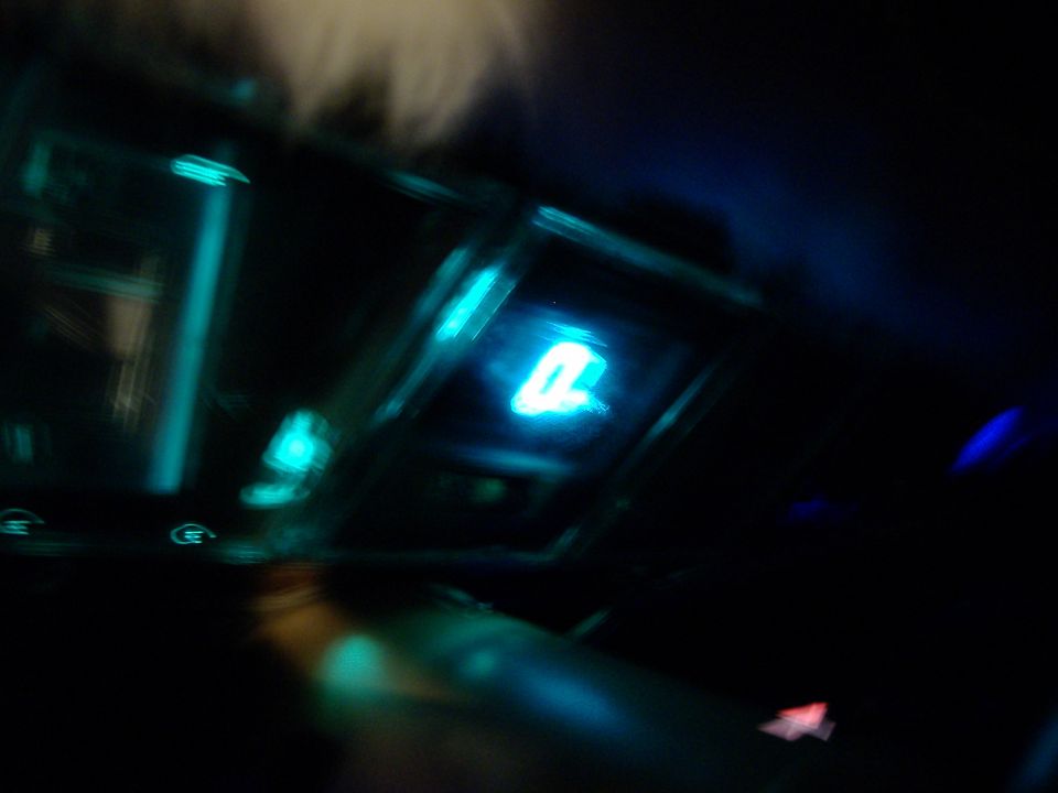 Dashboard gauge cluster with glowing blue digital display