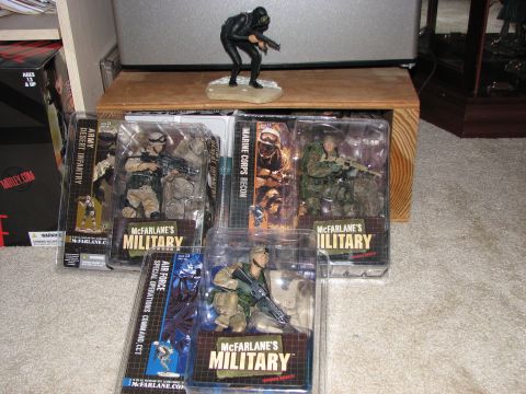 1991 Ford Bronco - Several McFarlane's Military action figures are displayed in their original packaging, including Army Desert Infantry and Marine Corps Reco…