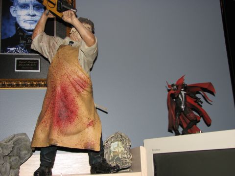 1991 Ford Bronco - A display shelf features a Leatherface figure, a Spawn figure, and a framed picture.