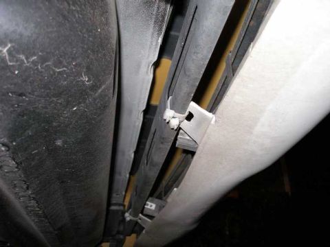 2001 Ford Crown Victoria - KCHP must have "tucked" the bumper to prevent it from tearing during median turnarounds, etc. This was achieved with "zip ties".