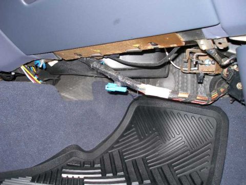 2001 Ford Crown Victoria - What the passenger side footwell looked like before installing the courtesy lamp and panel. Note the blue connector for "dark car mode".