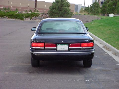 1998 Ford Crown Victoria - Rear view of a black 1998 Ford Crown Victoria sedan parked outdoors.