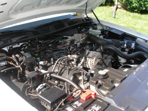 2001 Ford Crown Victoria - The engine bay of a 2001 Ford Crown Victoria is shown with various components and wiring.