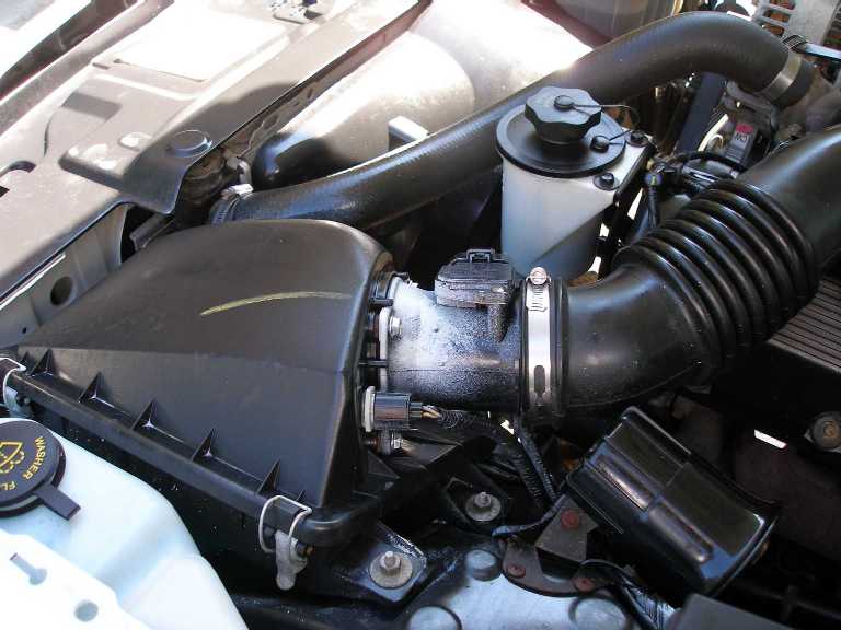2001 Ford Crown Victoria engine bay showing air intake and hoses