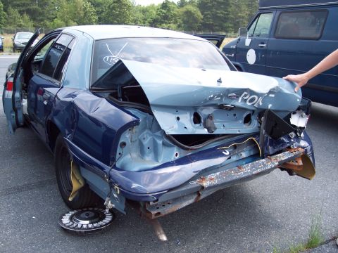 1991 Ford LTD Crown Victoria - This 1991 Ford Crown Victoria LTD shows extensive damage to its rear, with the trunk and bumper severely compromised.