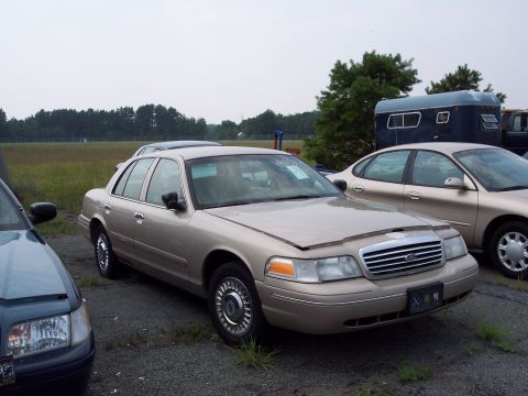 1991 Ford LTD Crown Victoria - This 1991 Ford Crown Victoria LTD sedan is seen in a lot with other vehicles.