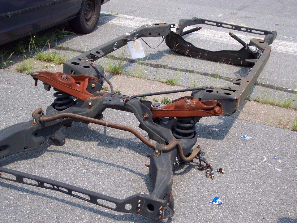 Car frame with suspension components and rust