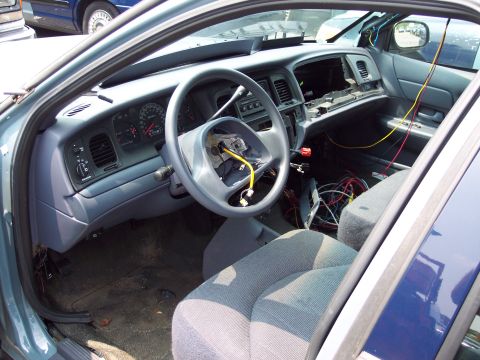 1991 Ford LTD Crown Victoria - The interior of a 1991 Ford Crown Victoria LTD shows exposed wiring and a disassembled dashboard, indicating it is in a state of repair or…
