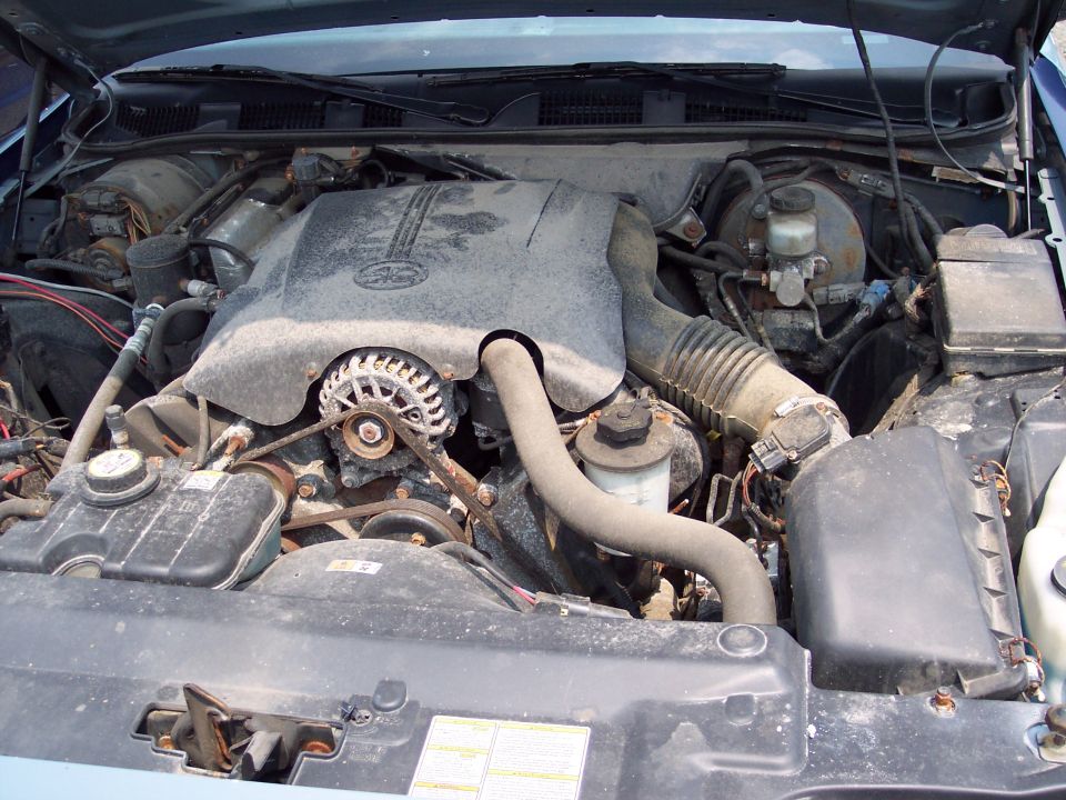 1991 Ford Crown Victoria engine bay with V8 engine, alternator, and air intake