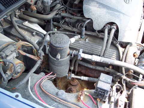 1991 Ford LTD Crown Victoria - Close-up view of a vehicle's engine bay, showing components and wiring.
