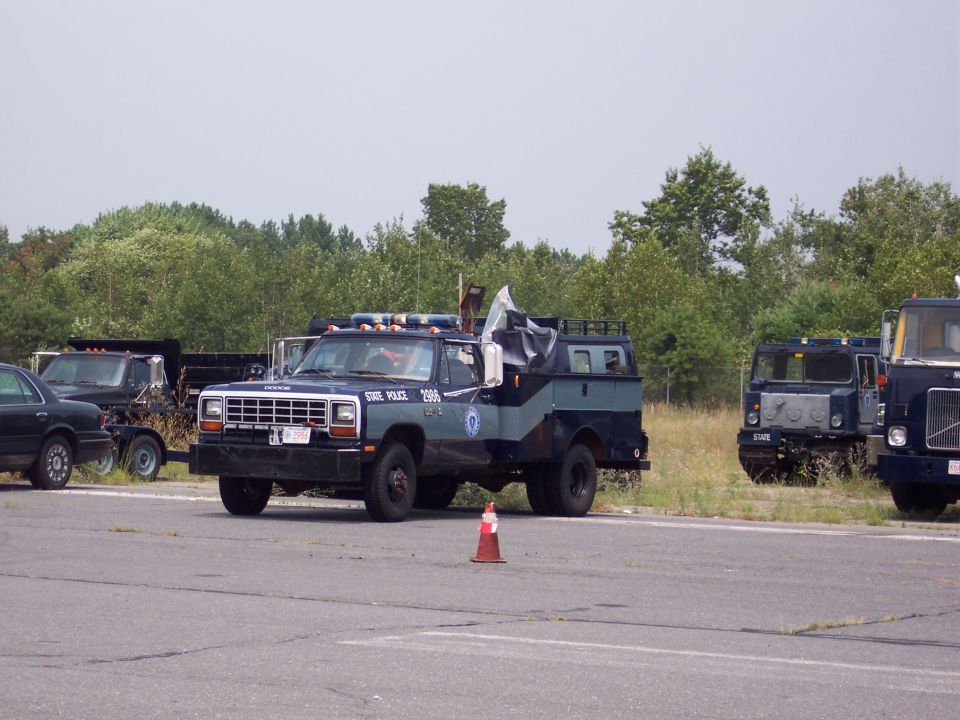 Dodge Ram police truck with "STATE POLICE 2906" text, 3q-front view