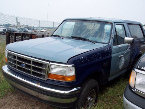 1991 Ford LTD Crown Victoria - This Ford Bronco is seen in a lot with other vehicles.