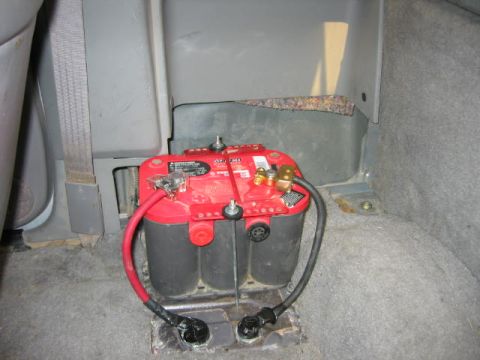 1997 Ford Ranger - Optima Red Top battery installed in the rear seat area of a vehicle, with custom wiring.