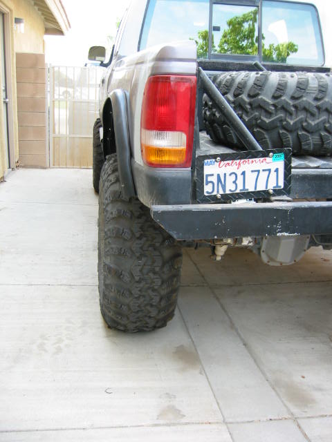 1997 Ford Ranger - This modified pickup truck features oversized tires and a spare tire mounted in the bed.