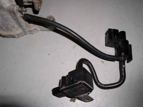 1996 Ford Probe - Engine part with hoses and solenoids, possibly from a Ford Probe GT.