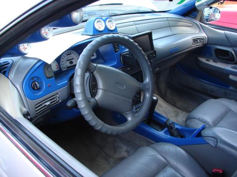 1992 Ford Taurus - The interior of a 1992 Ford Taurus features custom blue accents and additional gauges.