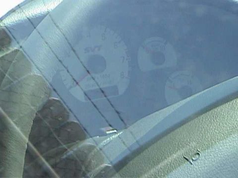 1989 Ford Mustang - Close-up of dashboard gauges, including an SVT logo, suggesting a performance Ford model.