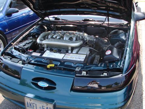 1992 Ford Taurus - Engine bay of a 1992 Ford Taurus SHO, showing the V6 engine and intake system.