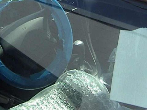 1989 Ford Mustang - Interior view of a 1989 Ford Mustang, showing the dashboard covered in protective wrapping.