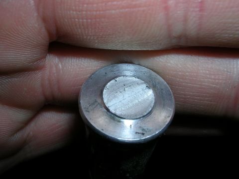 1996 Ford Probe - A close-up view of a metal shifter knob, showing its machined surface and a person's hand.