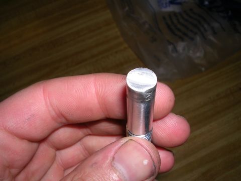 1996 Ford Probe - Close-up of a metal pin being held in a person's hand.