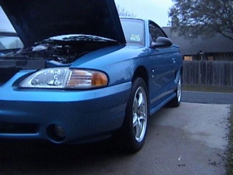 1989 Ford Mustang - This blue Ford Mustang appears to be from the mid-1990s, not a 1989 model.