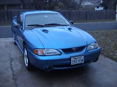 1989 Ford Mustang - This blue Ford Mustang features dual hood scoops and a distinctive front end.