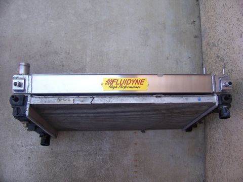 2002 Ford Mustang - A Fluidyne high performance radiator is shown against a concrete background.