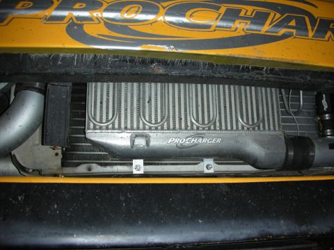 1992 Ford Crown Victoria - Close-up view of a ProCharger intercooler and radiator assembly, with visible text on the intercooler.