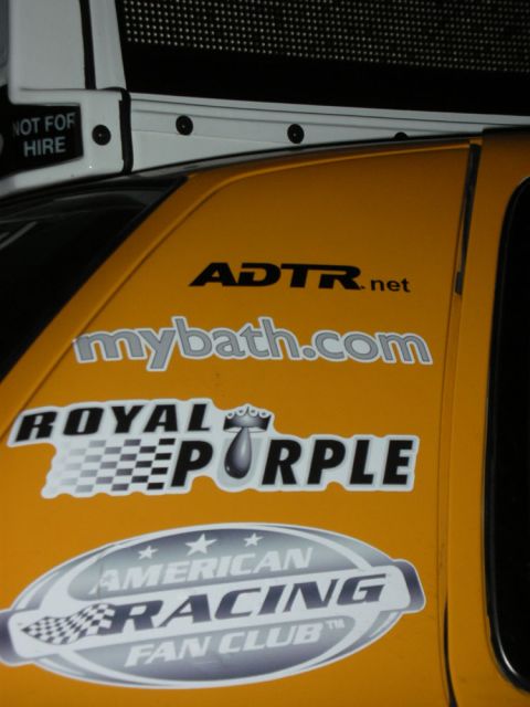 1992 Ford Crown Victoria - Vehicle side displays various sponsor decals including ADTR.net and American Racing Fan Club.