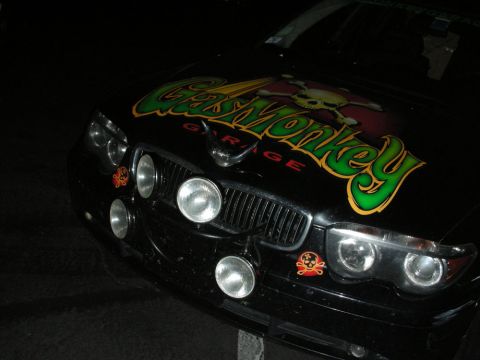1992 Ford Crown Victoria - Front view of a black car with prominent Gas Monkey Garage branding and additional lighting on the grille.