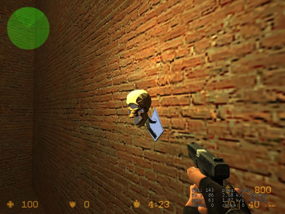 Skull decoration on brick wall with a handgun in the foreground