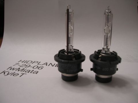 1996 Toyota 4Runner - Two HID headlight bulbs are shown on a paper with handwritten and printed text, including a website address.