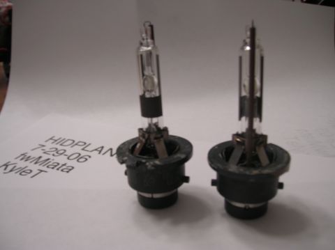 1996 Toyota 4Runner - Two HID headlight bulbs are shown on a piece of paper with handwritten notes.
