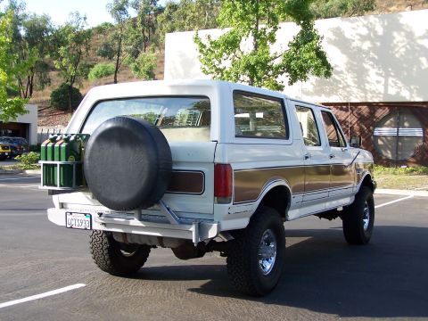 1988 Ford C-350 (Centurion Conversions) - This 1987 Ford Bronco is equipped with a rear-mounted spare tire and jerry cans.