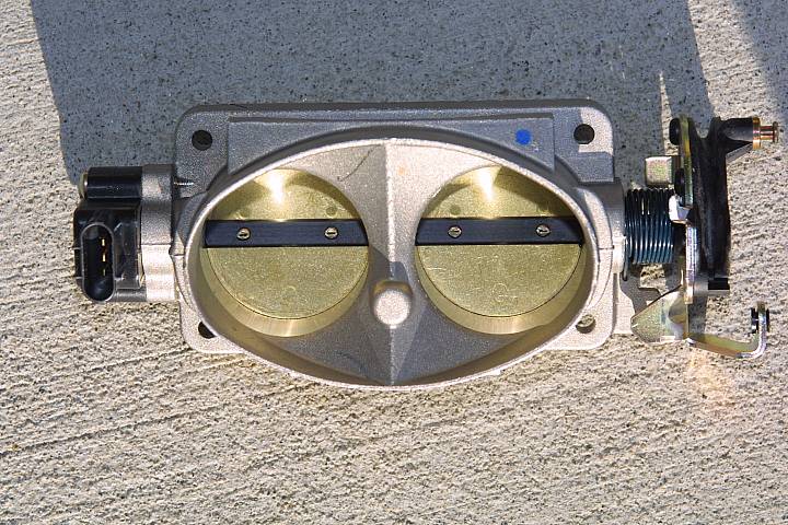 Twin-bore aluminum throttle body with gold butterflies, TPS sensor and throttle lever