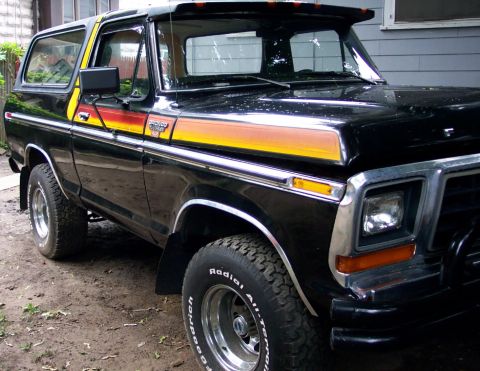 1979 Ford Bronco - This black Ford Bronco features a distinctive stripe decal package along its side.