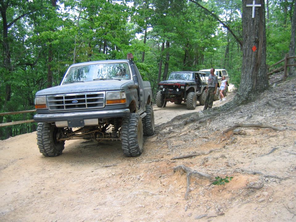 Lifted 1992 Ford F-Series truck front view on dirt road