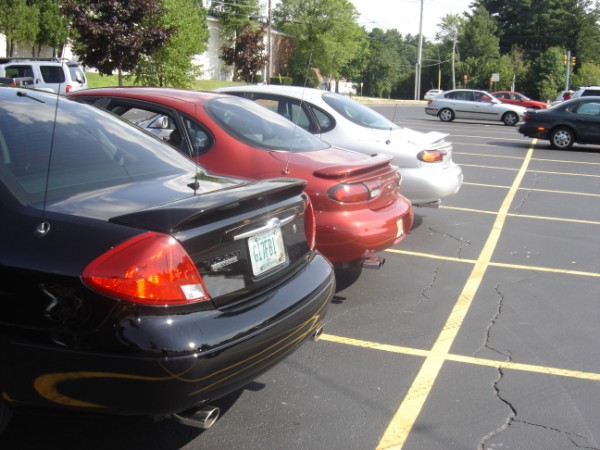 1999 Ford Taurus rear view, black sedan with license plate G17FB1