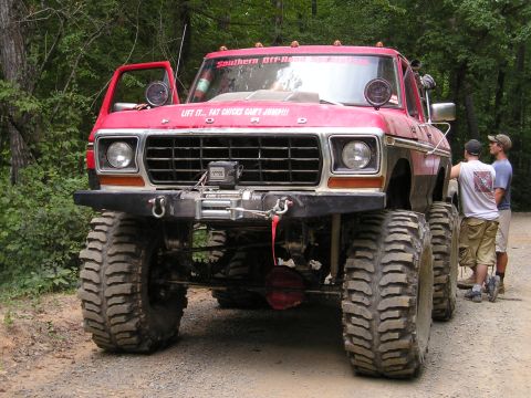1996 Ford Bronco - This heavily modified 1979 Ford F-Series truck features oversized tires and a winch, indicating it is built for off-road use.