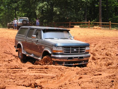 1996 Ford Bronco - This 1996 Ford Bronco is navigating a challenging muddy terrain.