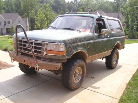 1996 Ford Bronco - This 1996 Ford Bronco features a custom front bumper and off-road tires, suggesting it's ready for terrain.