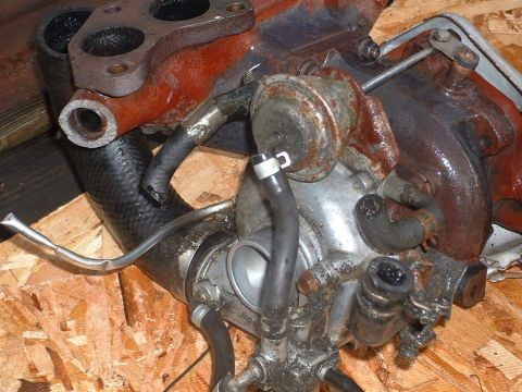 1991 Ford Probe - Close-up of a turbocharger assembly, showing its components and connections.