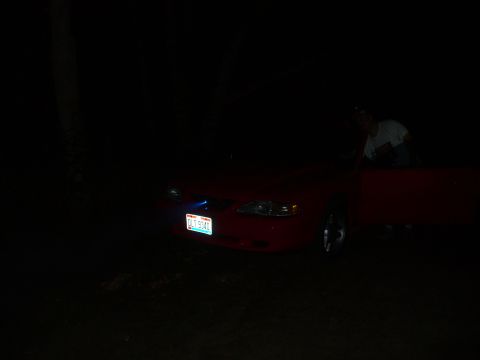 1991 Ford Probe - This 1991 Ford Probe is seen at night with its headlights on and license plate illuminated.